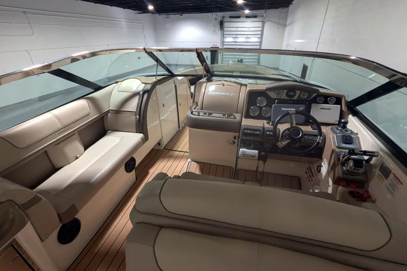 Slide: The Image of 2014 Formula 350 Crossover Bowrider interior with luxurious seating and modern dashboard. - 10