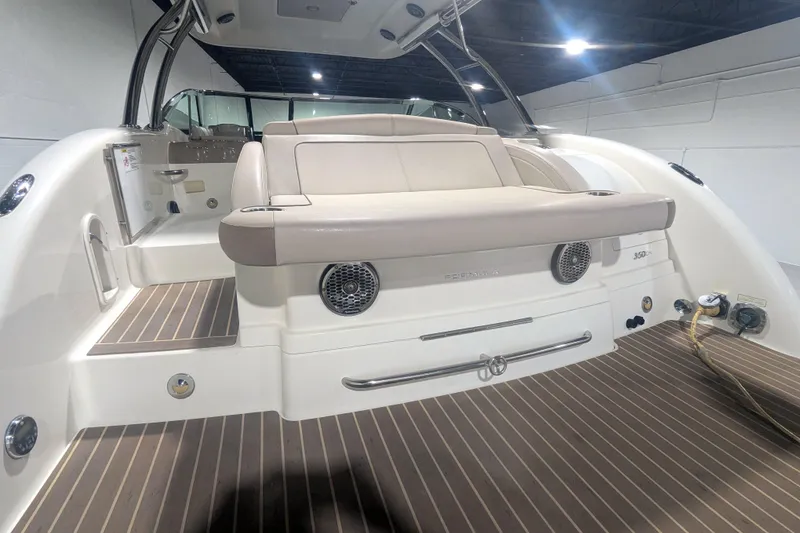 Slide: The Image of 2014 Formula 350 Crossover Bowrider interior with seating and wood-style flooring. - 18