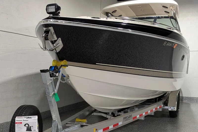 Slide: The Image of 2014 Formula 350 Crossover Bowrider on trailer in indoor storage. - 2