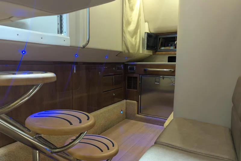 Slide: The Image of Interior of 2014 Formula 350 Crossover Bowrider with modern kitchen and seating area. - 23