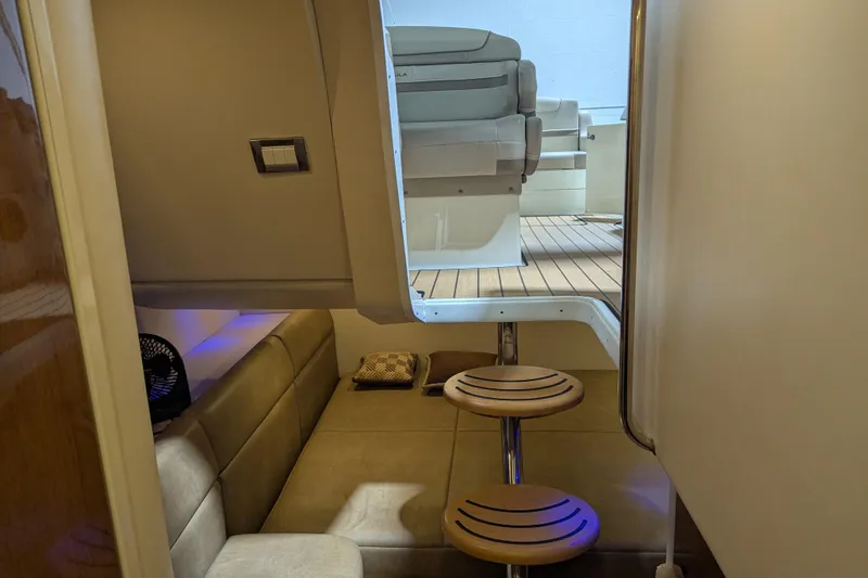 Slide: The Image of Interior view of 2014 Formula 350 Crossover Bowrider with seating and wooden steps. - 24