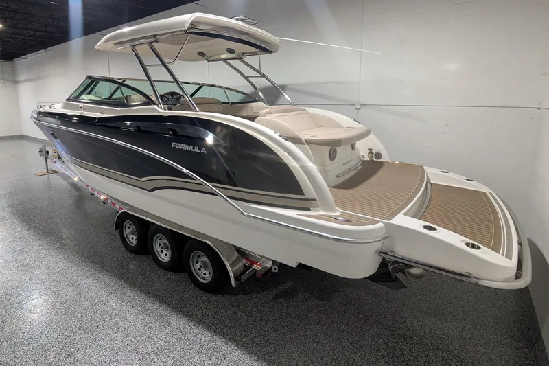 Slide: The Image of 2014 Formula 350 Crossover Bowrider boat on trailer in showroom. - 3