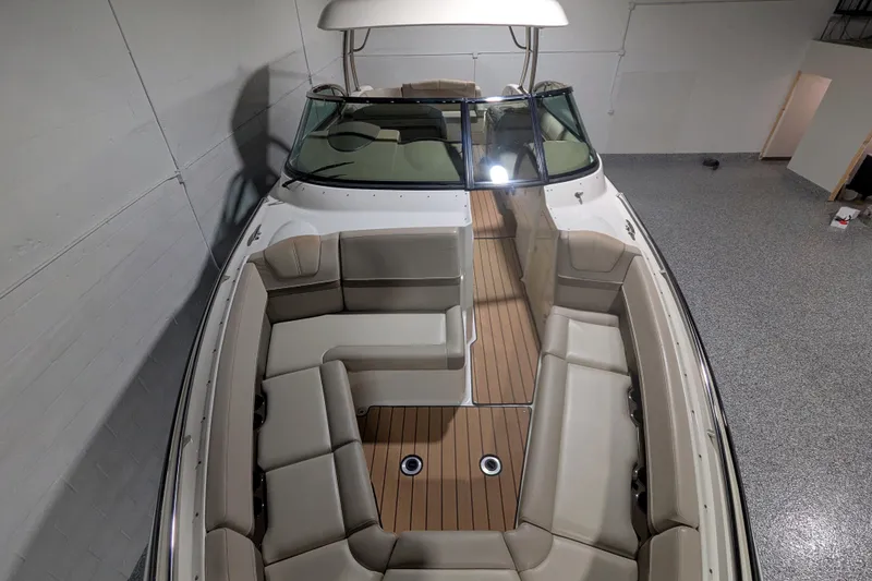 Slide: The Image of 2014 Formula 350 Crossover Bowrider with spacious seating and sleek design in a showroom. - 34