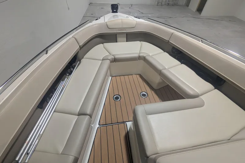 Slide: The Image of 2014 Formula 350 Crossover Bowrider interior with beige seating and teak flooring. - 35