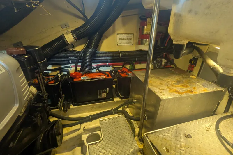 Slide: The Image of Engine compartment of a 2014 Formula 350 Crossover Bowrider with batteries and wiring. - 37