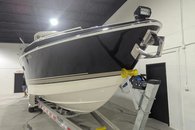 Slide: The Image of 2014 Formula 350 Crossover Bowrider on trailer in indoor storage facility. - 4