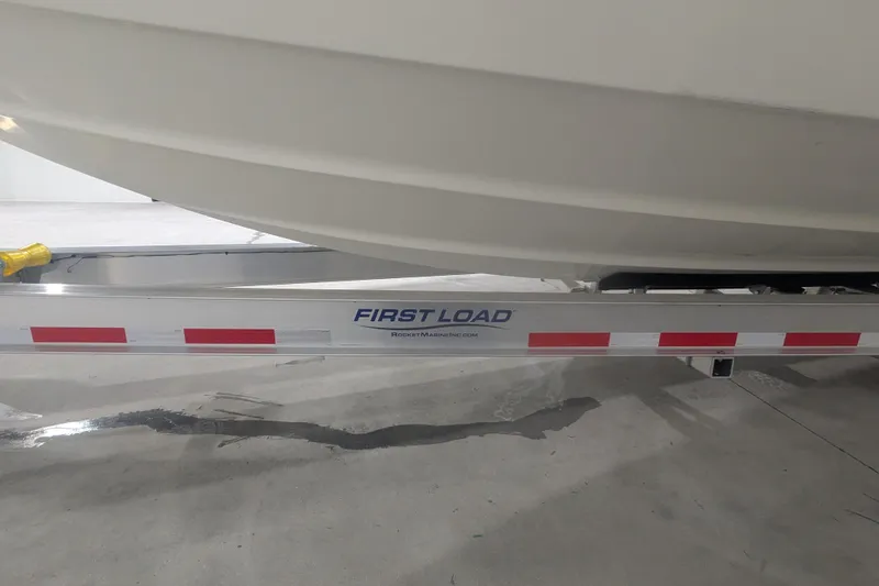 Slide: The Image of 2014 Formula 350 Crossover Bowrider on First Load trailer in garage. - 50
