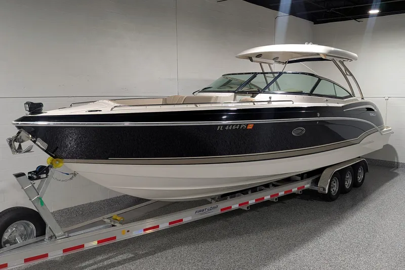 Slide: The Image of 2014 Formula 350 Crossover Bowrider on trailer in indoor showroom. - 6