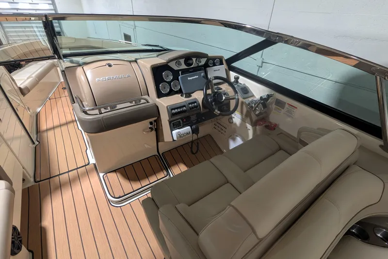 Slide: The Image of 2014 Formula 350 Crossover Bowrider interior with sleek dashboard and luxurious seating. - 9