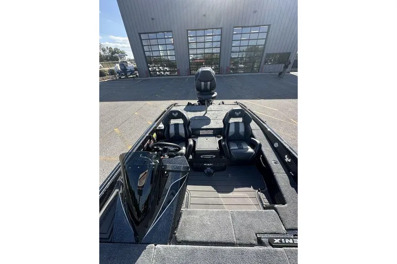 Slide: The Image of 2026 Phoenix 920 Elite X boat interior with dual seats and modern dashboard. - 11