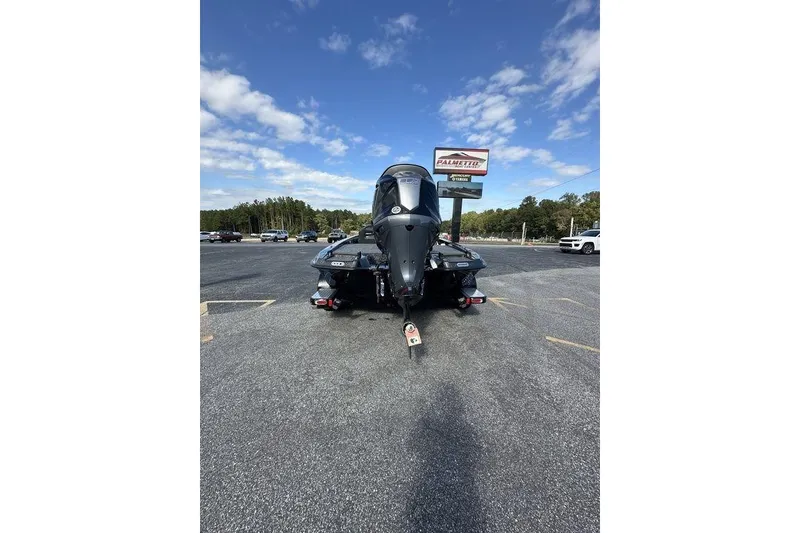 Slide: The Image of 2026 Phoenix 920 Elite X boat in parking lot under blue sky. - 3