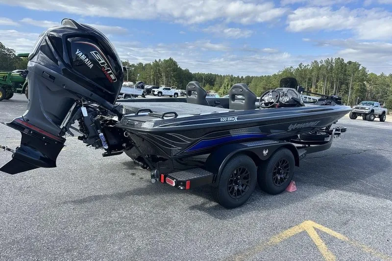 Slide: The Image of 2026 Phoenix 920 Elite X boat with Yamaha engine on a trailer in a parking lot. - 4