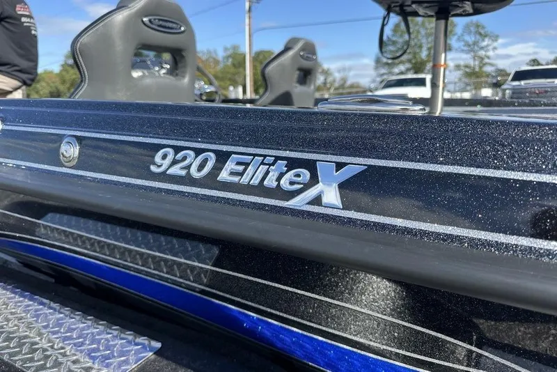 Slide: The Image of 2026 Phoenix 920 Elite X boat, close-up of model name on sleek exterior. - 5