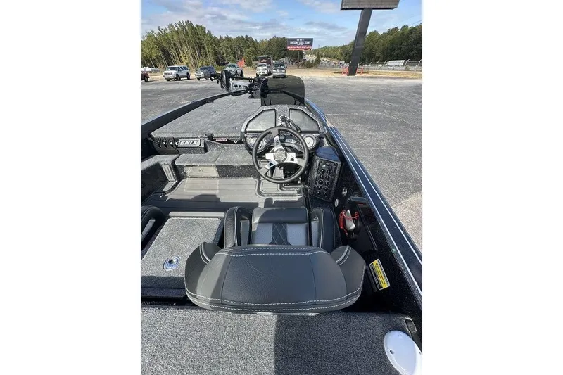 Slide: The Image of 2026 Phoenix 920 Elite X boat interior with steering wheel and dashboard controls. - 8