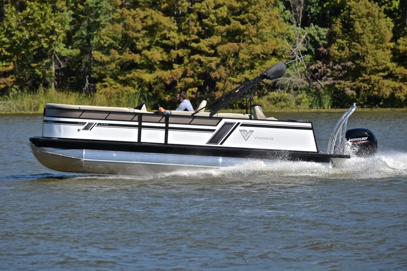 Slide: The Image of 2023 Viaggio Lago 22 R pontoon boat cruising on a lake. - 2