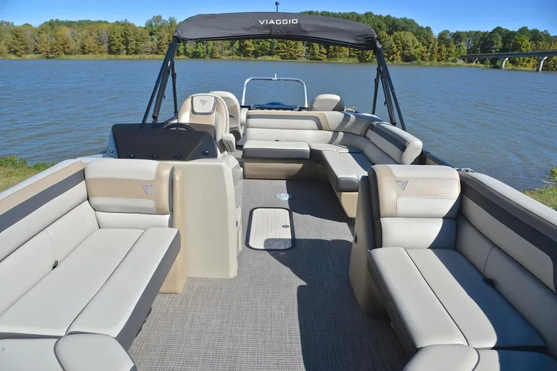 Slide: The Image of 2023 Viaggio Lago 22 R pontoon boat with spacious seating on a serene lake. - 20