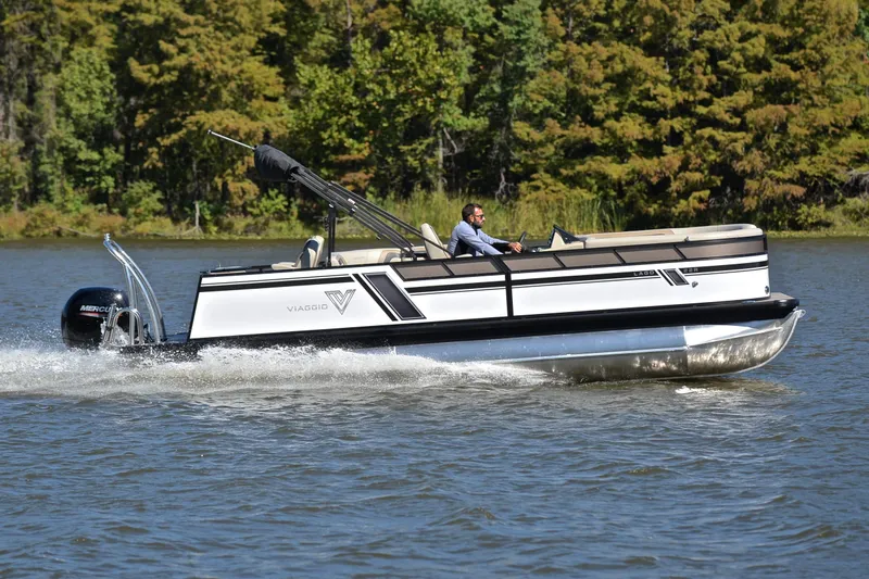 Slide: The Image of 2023 Viaggio Lago 22 R pontoon boat cruising on a scenic lake. - 3