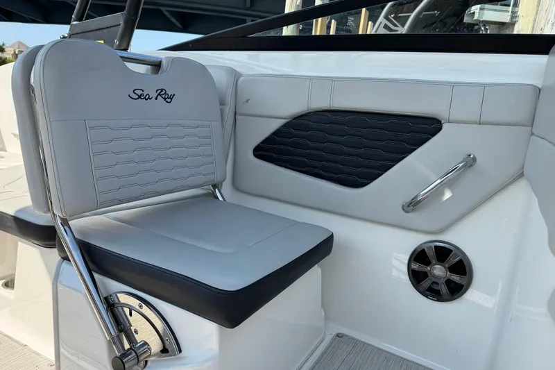 Slide: The Image of 2021 Sea Ray SPX 230 Outboard boat interior with stylish seating and speaker detail. - 9