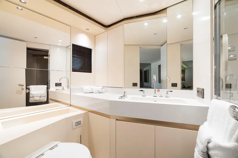 Slide: The Image of Luxurious bathroom interior on 2022 Azimut Magellano 25 Metri yacht, featuring modern fixtures and elegant design. - 13