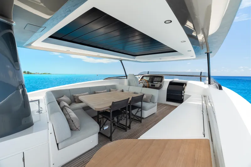Slide: The Image of Luxurious 2022 Azimut Magellano 25 Metri yacht deck with elegant seating and ocean view. - 22