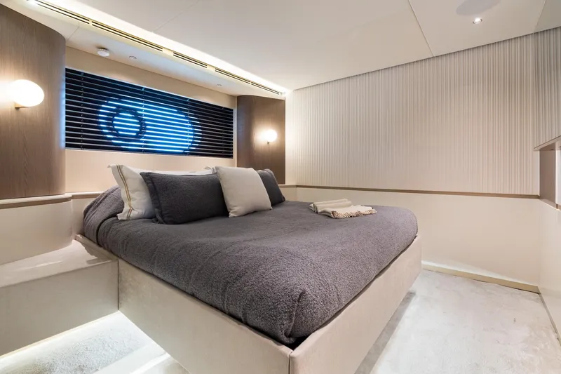 Slide: The Image of Luxurious bedroom interior on 2022 Azimut Magellano 25 Metri yacht, featuring modern design and cozy bedding. - 7