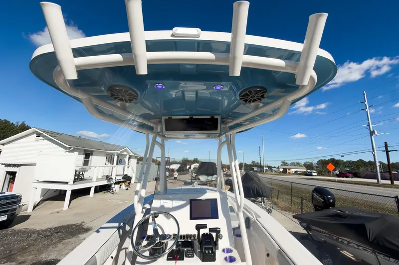 Slide: The Image of 2026 Sea Chaser 24 HFC DE boat console with advanced controls and overhead speakers. - 26