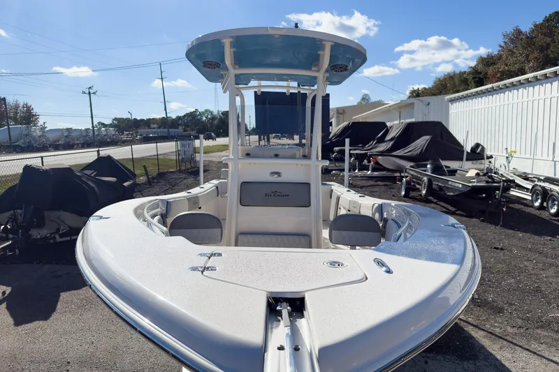 Slide: The Image of 2026 Sea Chaser 24 HFC DE boat, parked outdoors under a clear blue sky. - 32