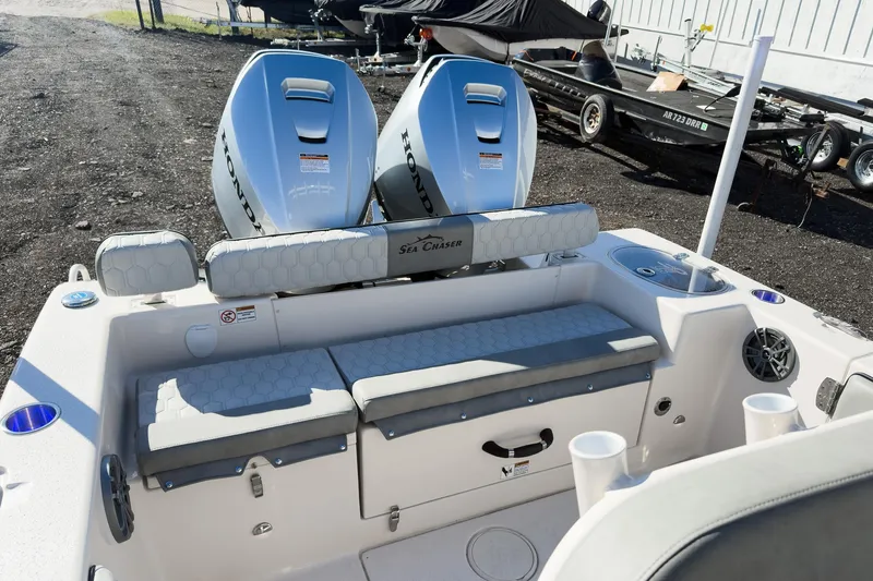Slide: The Image of 2026 Sea Chaser 24 HFC DE boat with dual Honda engines, rear seating area. - 38