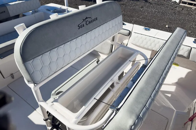 Slide: The Image of 2026 Sea Chaser 24 HFC DE boat interior with seating and storage. - 44