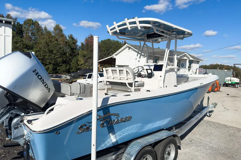 Slide: The Image of 2026 Sea Chaser 24 HFC DE boat with Honda outboard motor on trailer. - 51