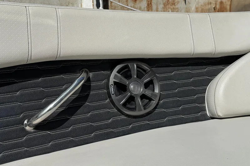 Slide: The Image of 2021 Sea Ray SPX 230 Outboard interior with speaker and handrail detail. - 11