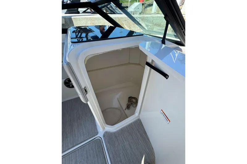 Slide: The Image of 2021 Sea Ray SPX 230 Outboard boat interior storage compartment. - 14