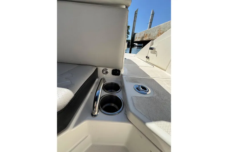 Slide: The Image of 2021 Sea Ray SPX 230 Outboard interior with cup holders and seating detail. - 20