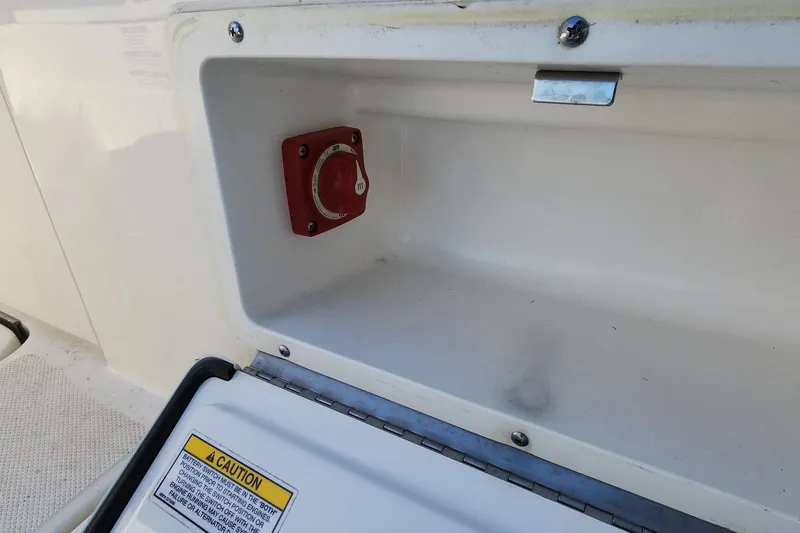 Slide: The Image of Battery switch compartment on 2021 Sea Ray SPX 230 Outboard boat. - 21