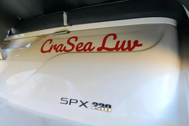 Slide: The Image of 2021 Sea Ray SPX 230 Outboard boat with "CraSea Luv" decal. - 25