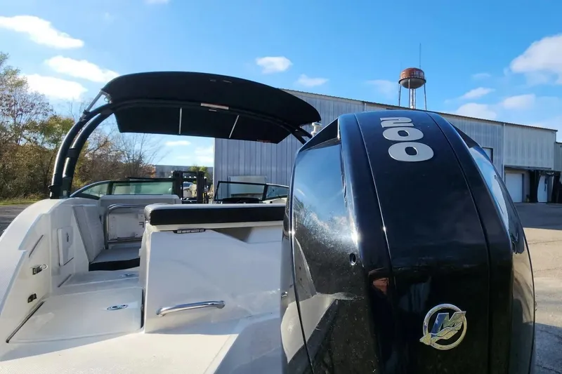 Slide: The Image of 2021 Sea Ray SPX 230 Outboard boat with powerful 200 HP engine, docked outdoors. - 29