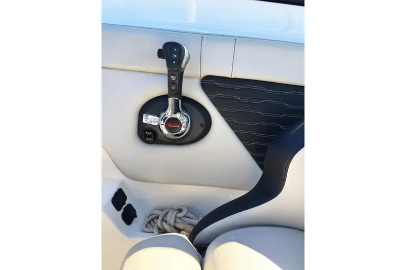 Slide: The Image of 2021 Sea Ray SPX 230 Outboard throttle control and interior detail. - 7