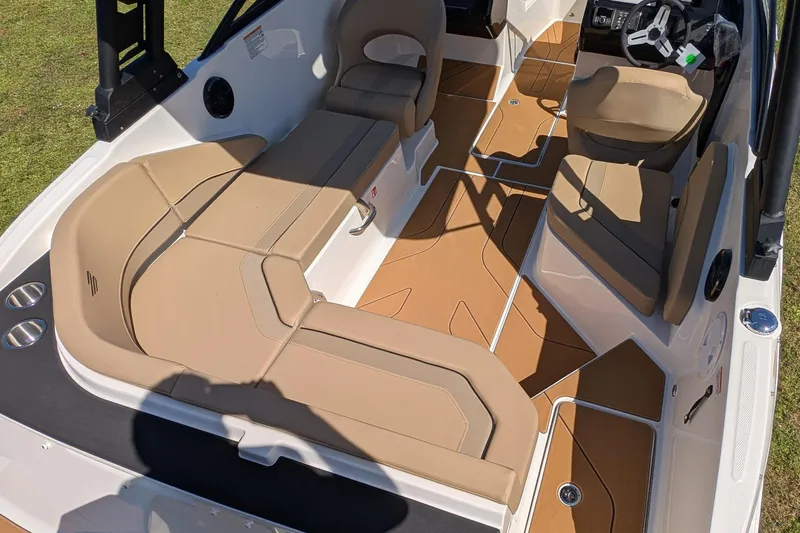 Slide: The Image of 2026 Bayliner V20 boat interior with tan seating and modern design. - 5