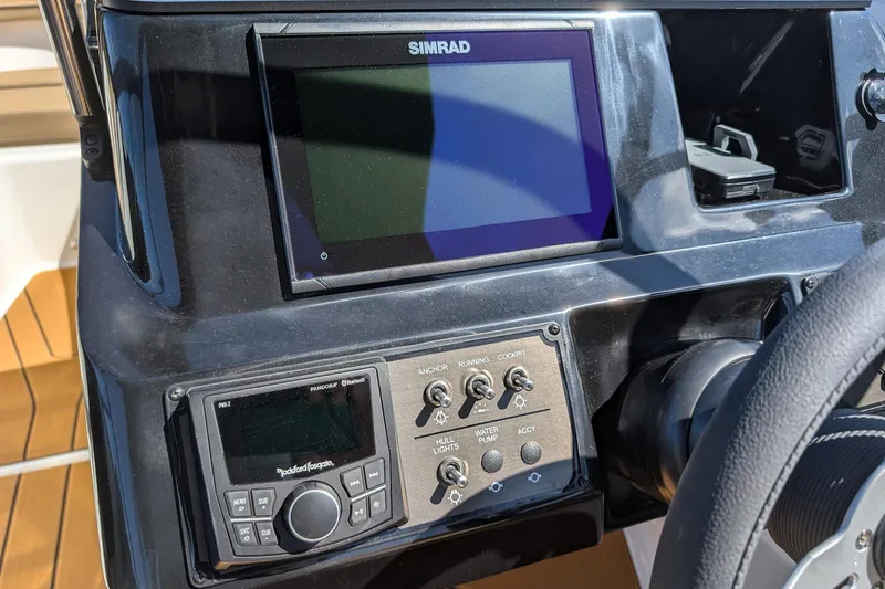 Slide: The Image of Dashboard of 2026 Bayliner V20 boat with Simrad display and control panel. - 9