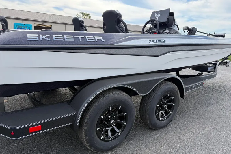 Slide: The Image of 2026 Skeeter ZXE21 boat on trailer, showcasing sleek design and modern features. - 14