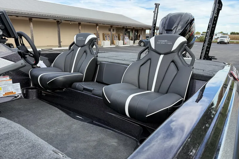 Slide: The Image of 2026 Skeeter ZXE21 boat interior with sleek black and white seating design. - 17