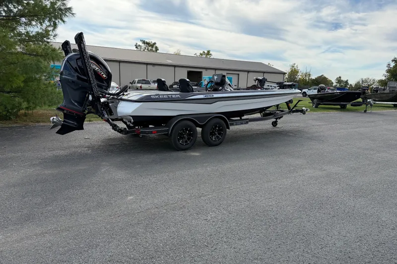Slide: The Image of 2026 Skeeter ZXE21 boat on trailer in parking lot, side view. - 3