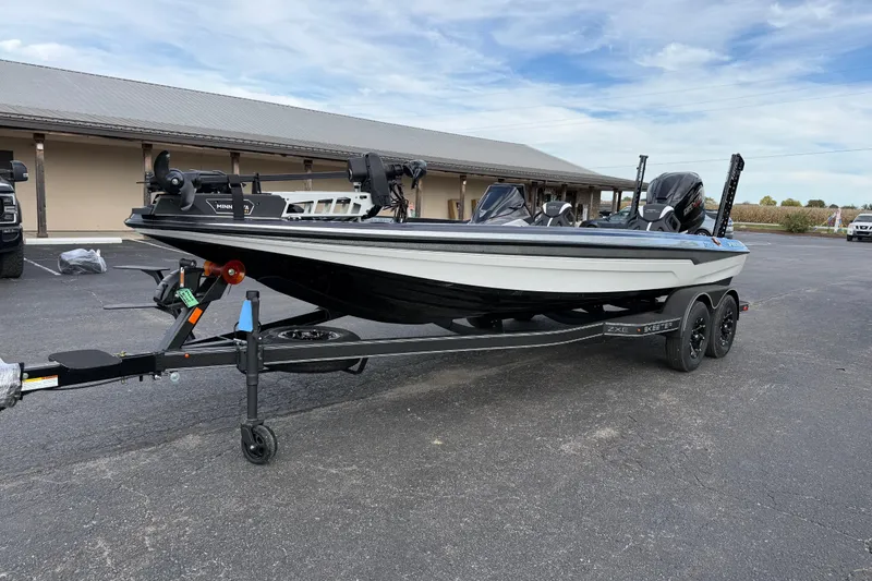 Slide: The Image of 2026 Skeeter ZXE21 boat on trailer, parked outdoors, showcasing sleek design and modern features. - 6