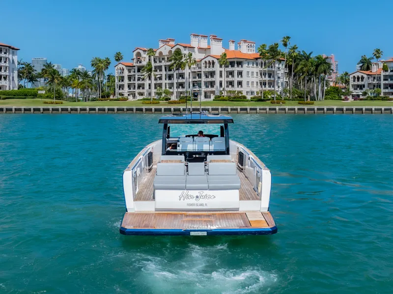 Slide: The Image of 2022 Fjord 44 Open yacht cruising near luxury waterfront residences. - 10