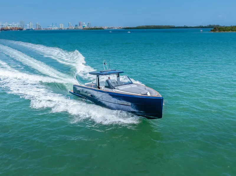 Slide: The Image of 2022 Fjord 44 Open yacht cruising on blue ocean near city skyline. - 17