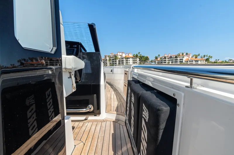 Slide: The Image of 2022 Fjord 44 Open yacht deck with wooden flooring and modern design. - 28