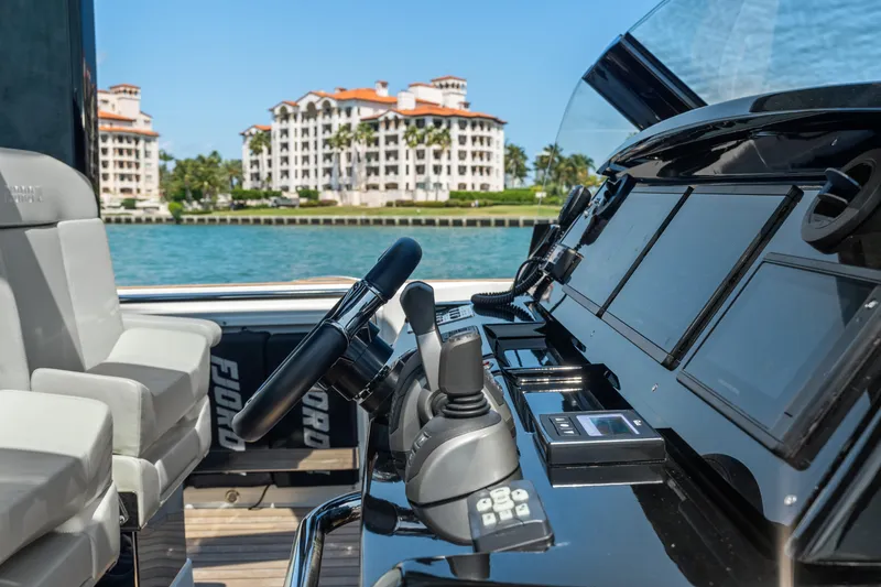 Slide: The Image of 2022 Fjord 44 Open yacht cockpit with luxury waterfront view. - 31