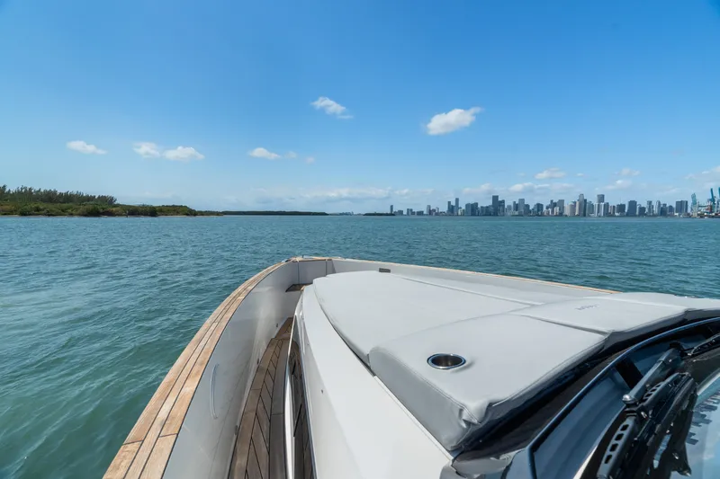 Slide: The Image of 2022 Fjord 44 Open yacht cruising with city skyline in the background. - 35