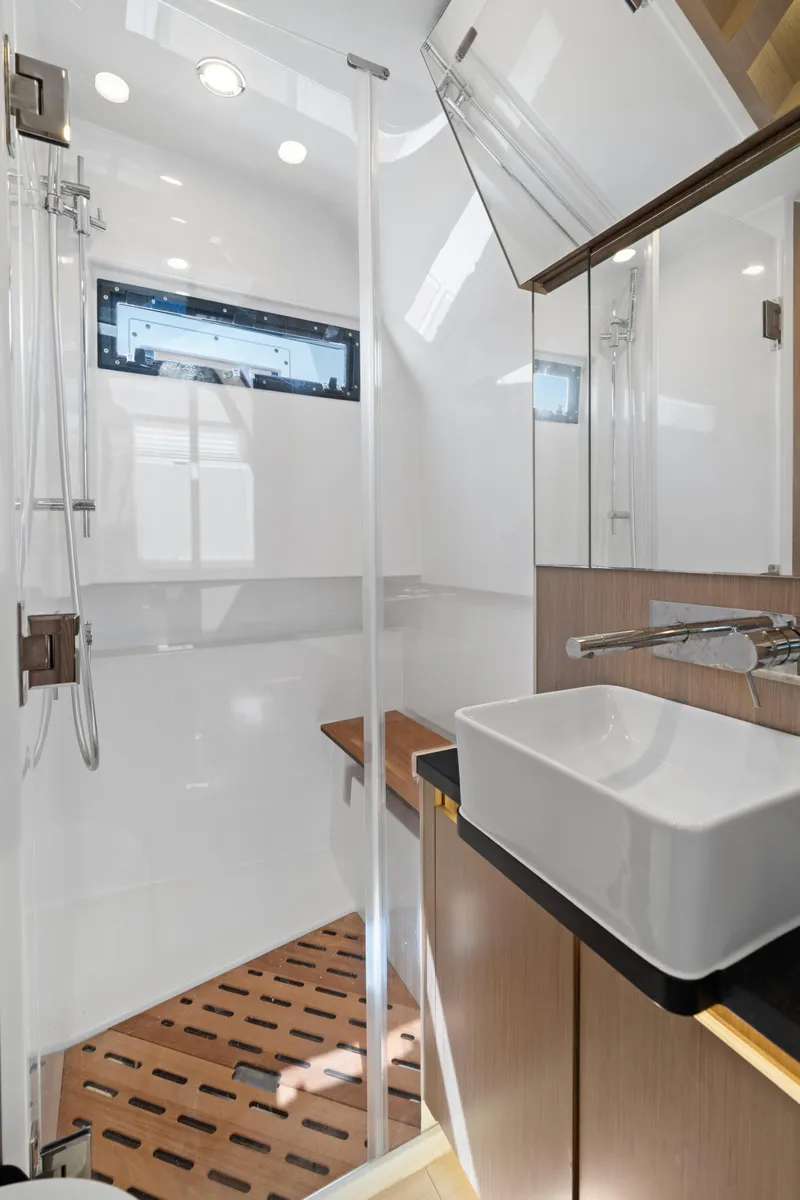 Slide: The Image of Modern bathroom interior of 2022 Fjord 44 Open yacht with sleek design and wooden accents. - 39