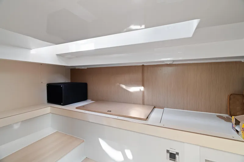 Slide: The Image of Interior of 2022 Fjord 44 Open yacht, featuring modern design and compact storage space. - 41